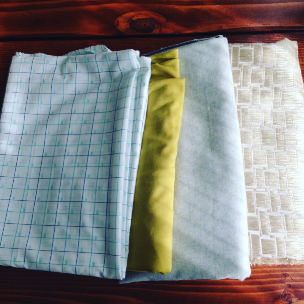 A fabric haul from one of my favorite stores that sources their wool from New Zealand. From left to right, a checkered cotton, a brightly colored knit merino wool, a woven wool blend, and a decorative gold brocade.