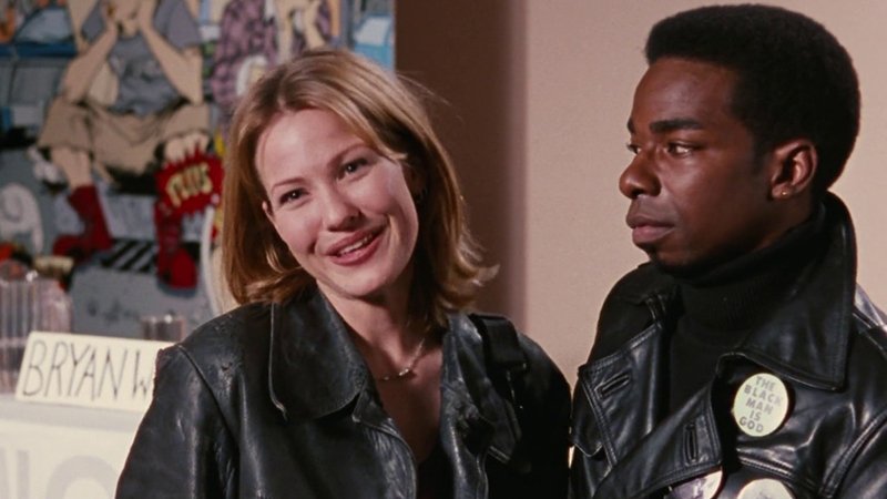 Hooper X looks at Alyssa while she smiles. chasing amy queer