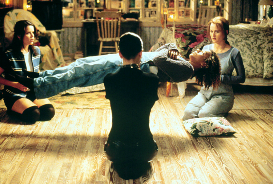 a screenshot from the craft showing the characters playing "light as a feather stiff as a board" with Rochelle floating in the center