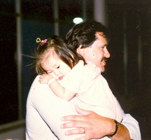 Dad holding me at the airport on June 15, 1984, shortly after we met for the first time.