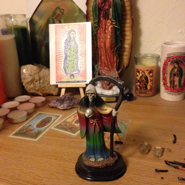 My Santa Muerte statue at the front of my altar.