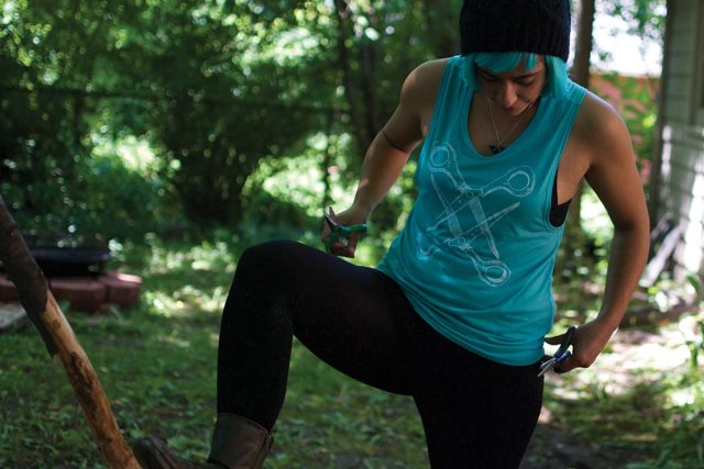 Sarah in this muscle turquoise scissor tank