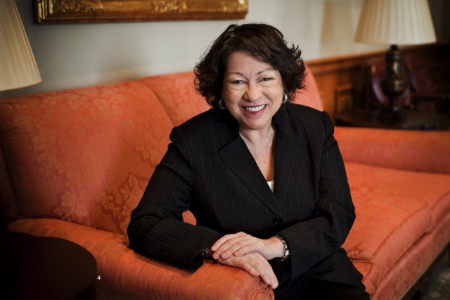 Justice Sonia Sotomayor seated on a couch