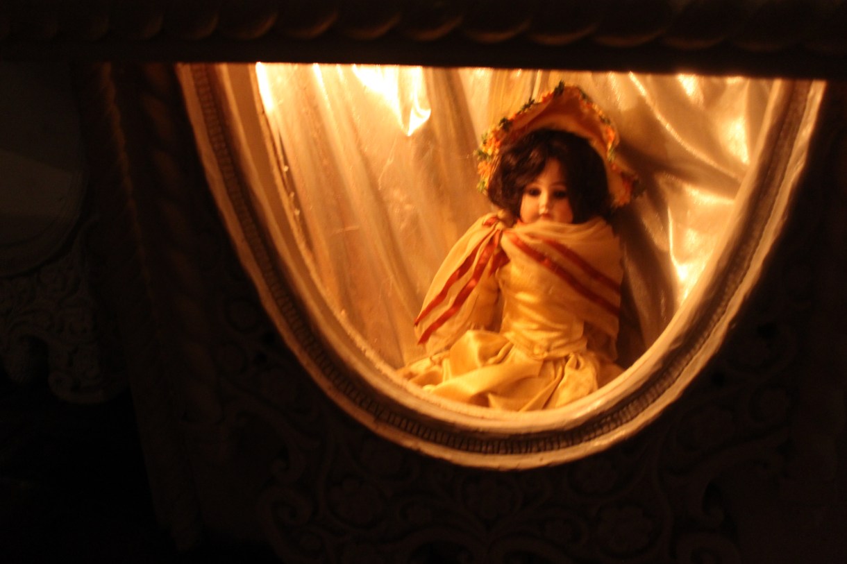 why is this doll trapped in this tiny room??