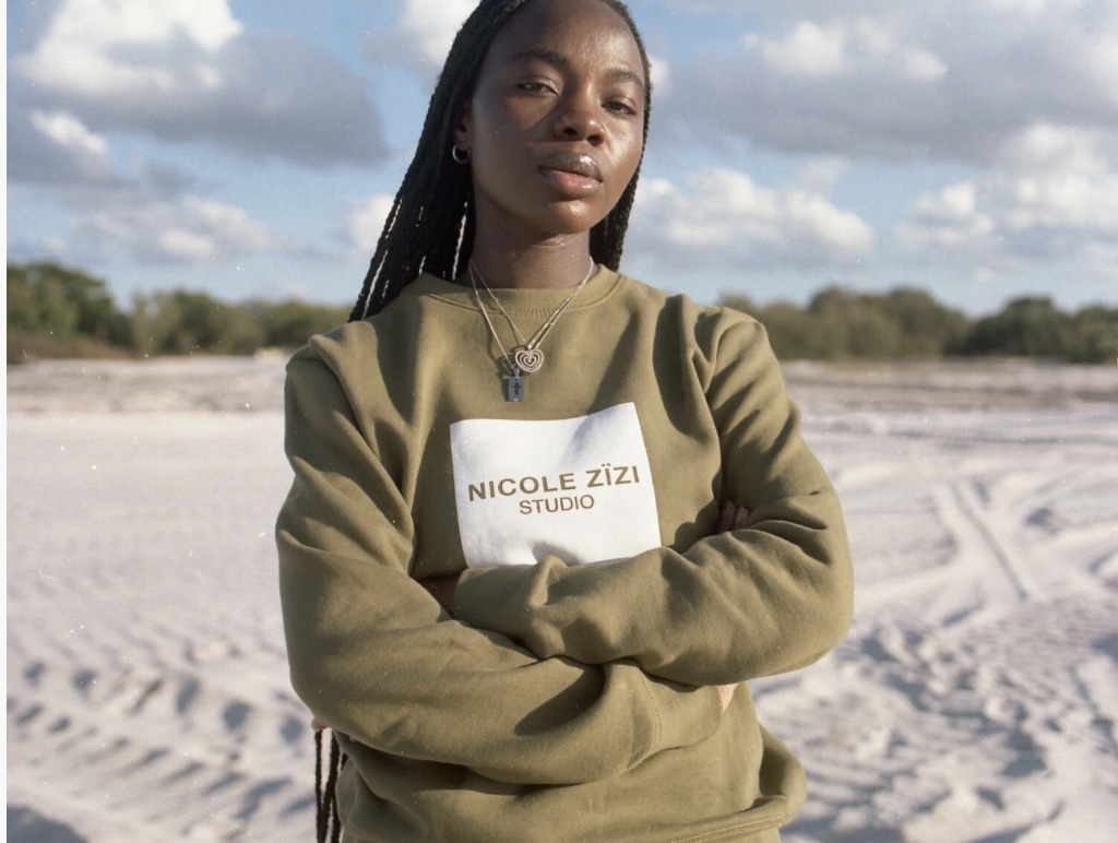 model in a Nicole Zizi studio sweatshirt