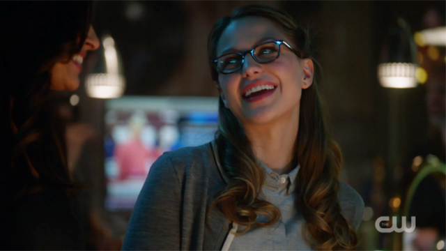 Kara smiles a knowing smile at Maggie.