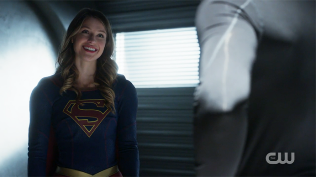 Supergirl beams at J'onn.