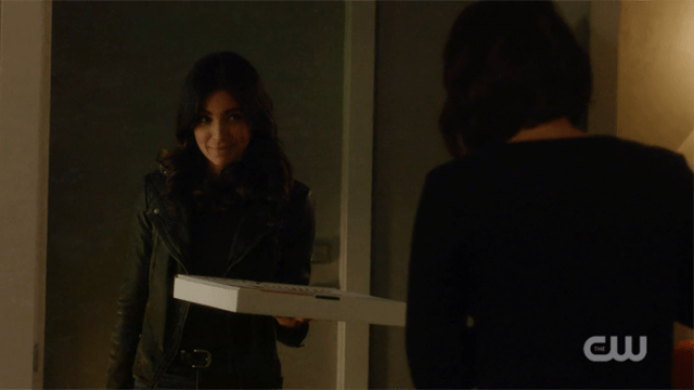Maggie at Alex's door with a pizza box