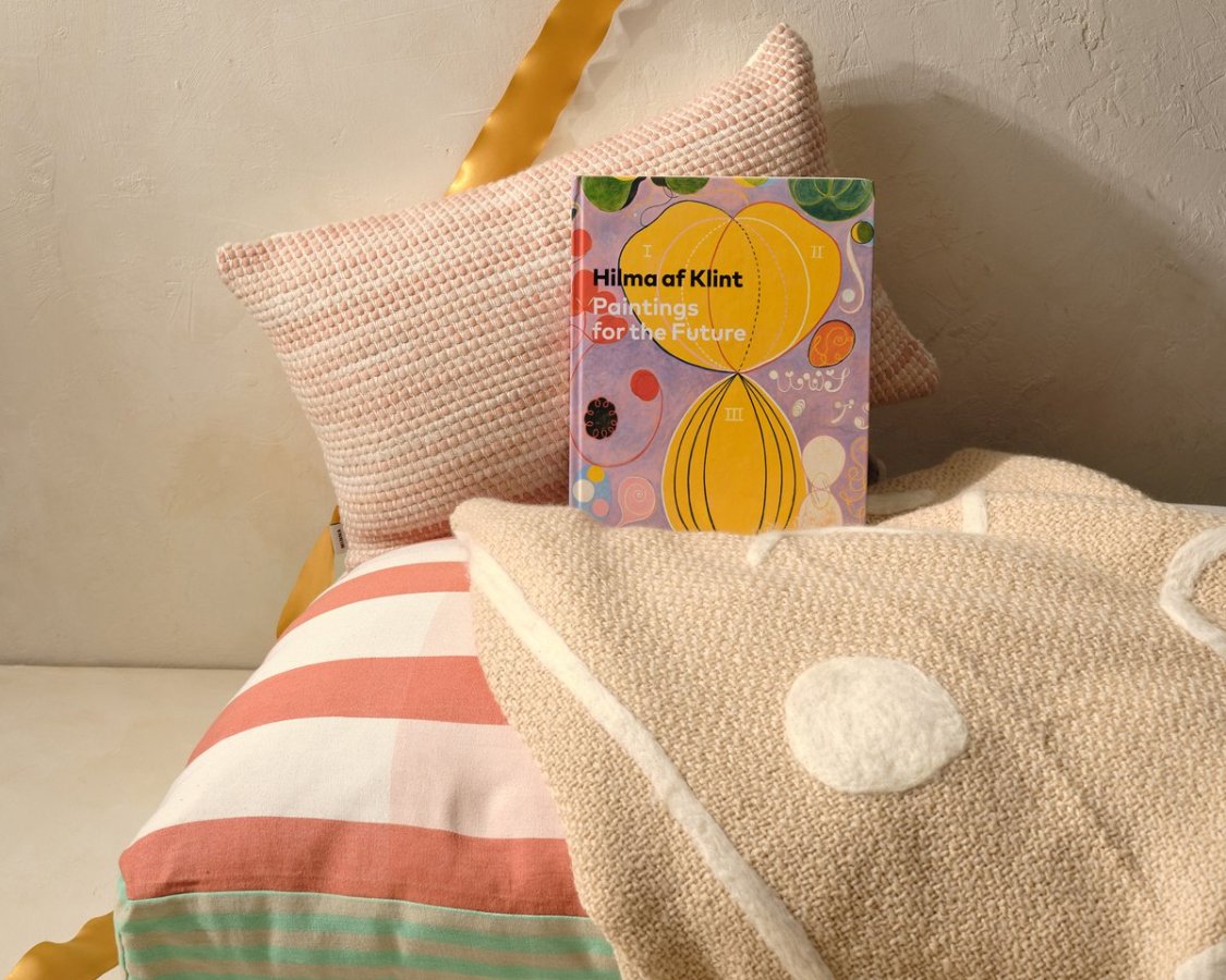 pillow, linens and book from Minna GOods