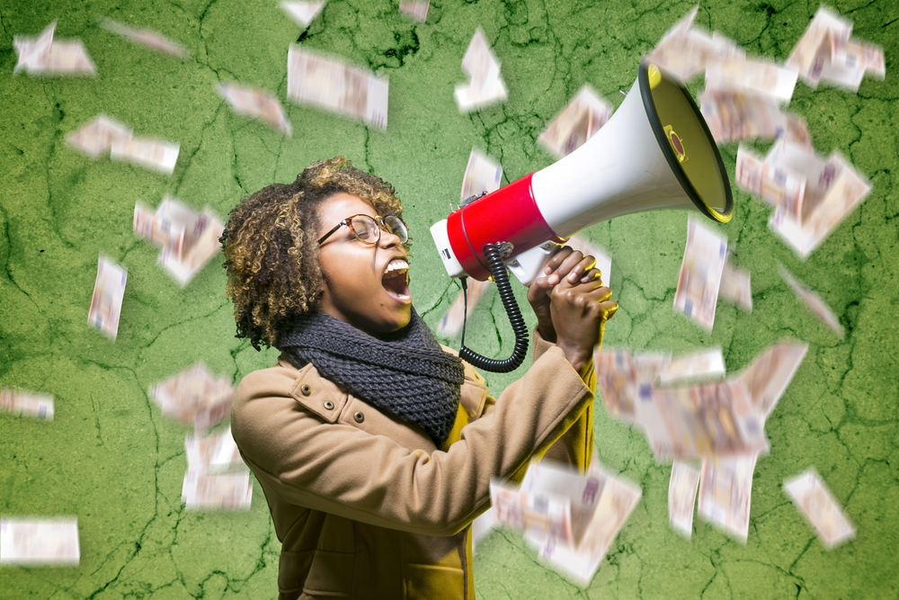 young Black woman shouting into a megaphone