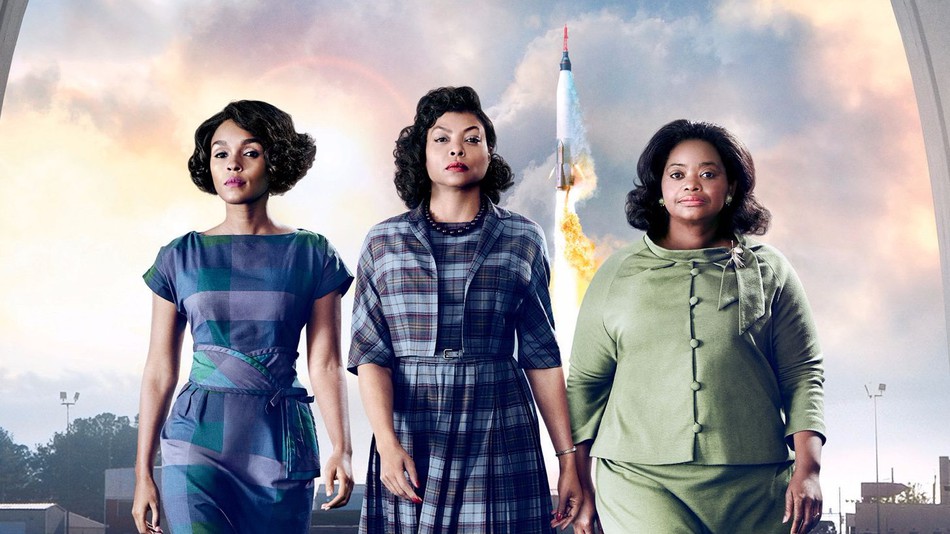 Three black women in front of a rocket. Caption: Janelle Monáe, Taraji P. Henson and Octavia Spencer play Mary Jackson, Katherine Johnson and Dorothy Vaughn, respectively. Via 20th Century Fox.