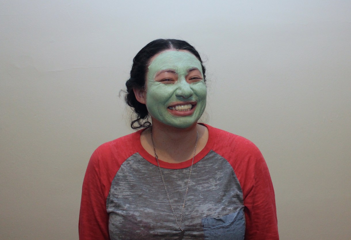 laura with a green face mask on