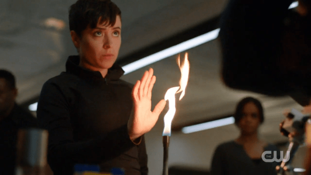 Vasquez puts her hand into the flame