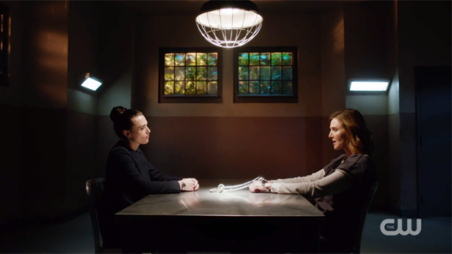 Lena and Lillian sit across the table from one another, not unlike they're playing chess
