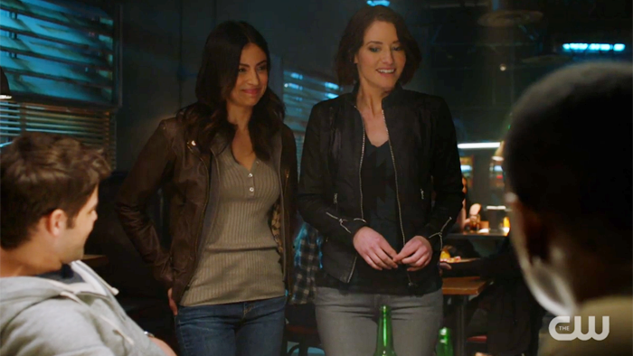 Maggie is smiling and Alex stands next to her, nervous