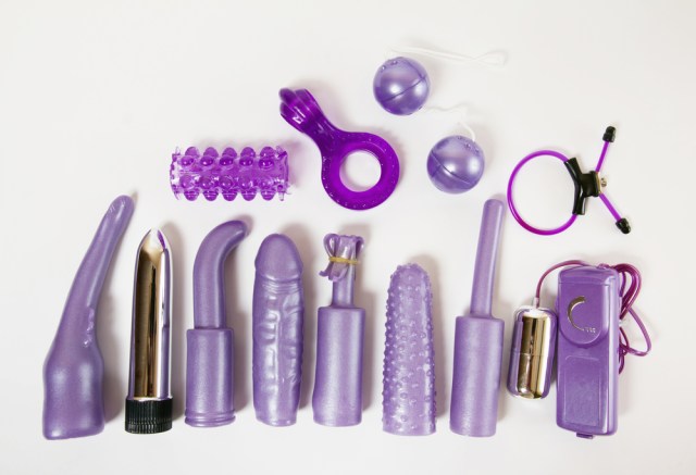 A pile of various kinds of sex toys, all in some shade of purple