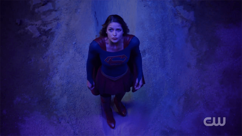 Supergirl looks up at the sky helplessly