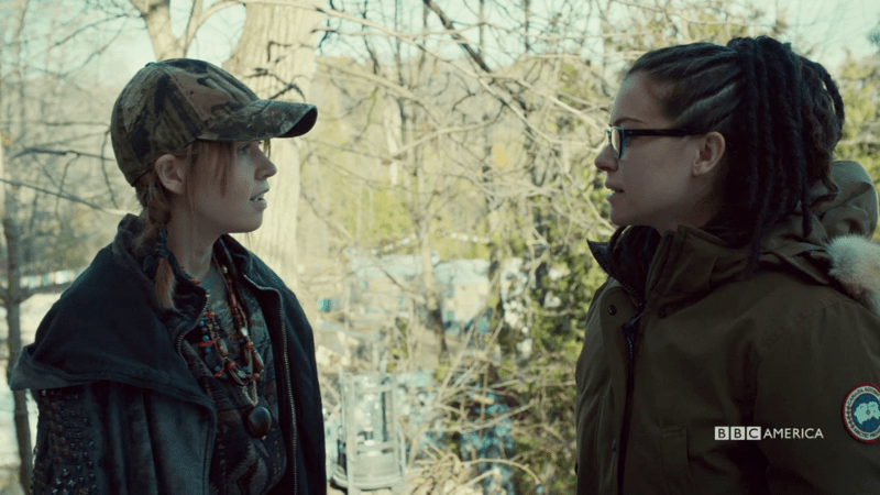 Mud does her cult smile while Cosima regards her questioningly