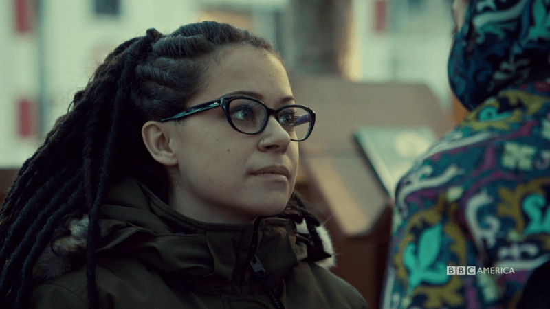 Cosima looks at Aisha kindly while she examines her