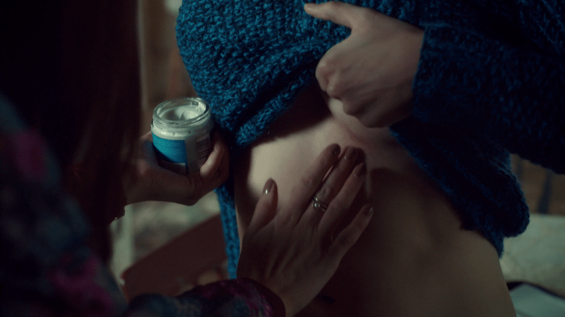 Waverly puts cream on Nicole's underboob