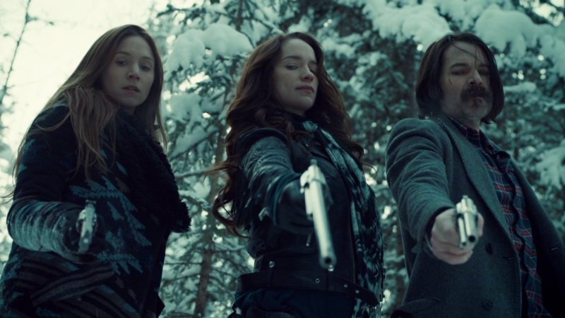 Waverly, Wynonna and Doc all point guns down at the camera