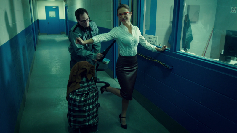 Waverly holds her arms out and pops her heel up in her little british librarian outfit