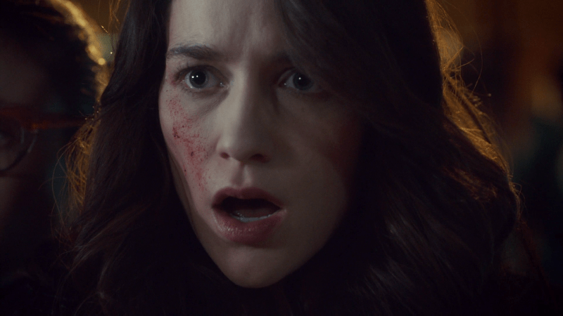 Wynonna's face is horrified as it is splattered with Eliza's blood