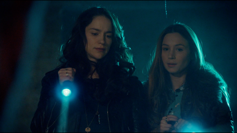 Wynonna and Waverly look...not surprised but surely not pleased upon finding the hellmouth and dead stupid earl