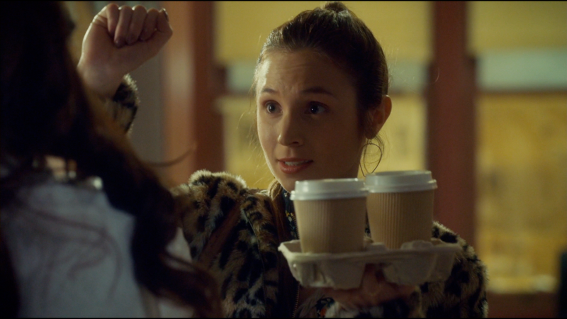 Waverly blocks Wynonna's almost-stab while holding a tray of coffee