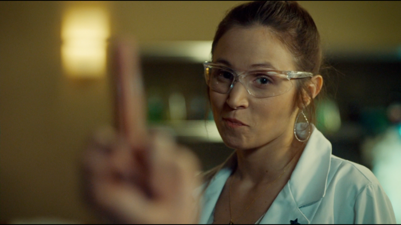 Waverly smirks as Wynonna puts up her middle finger as content for a note to leave Lucado