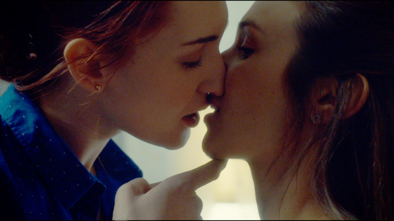 Nicole lifts Waverly's chin up ever so gently and goes in for the kiss