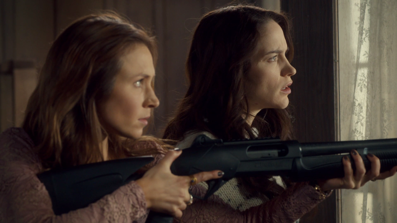 Wynonna and Waverly in profile, Waverly with her big-ass gun