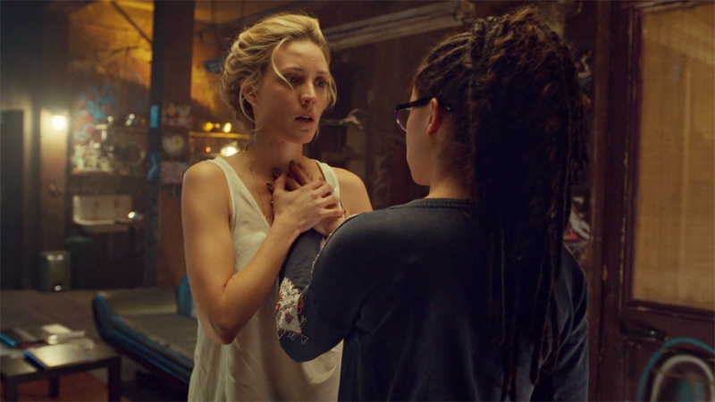 Delphine holds Cosima's hand over her heart