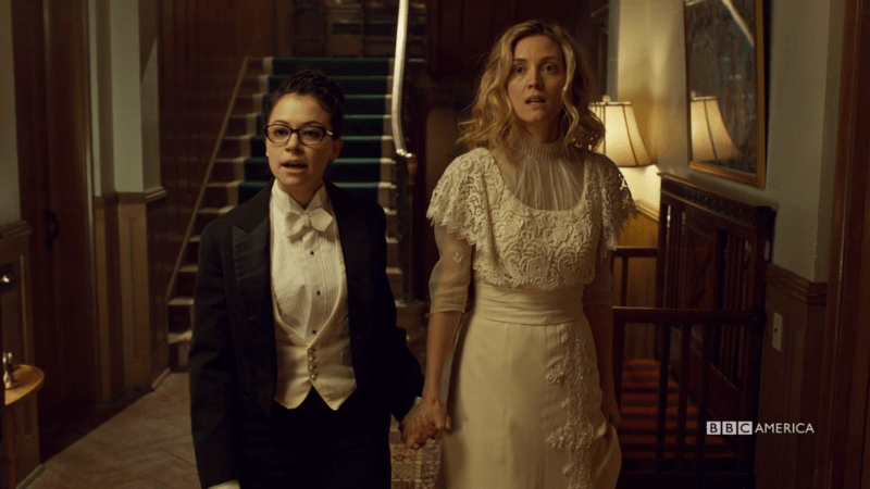 Cosima is in a full tux and Delphine is in a vintage wedding gown