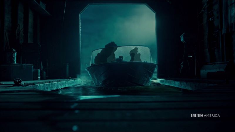 Cosima and Charlotte's sillohuttes are all we see as the boat pulls out into the night