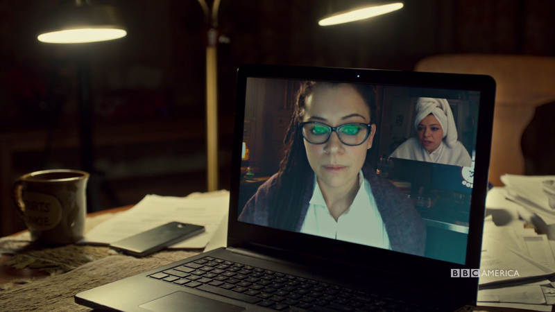 Sarah's screens shows Cosima and Alison and Ali is in a towel
