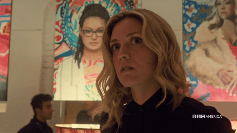 Delphine looks a little alarmed and the painting of Cosima is over her shoulder