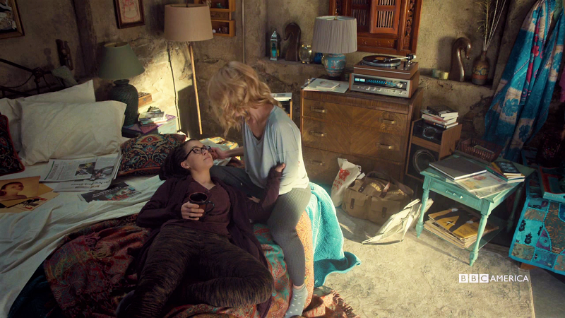 Cosima lays in Delphine's lap and they're cute and they love each other