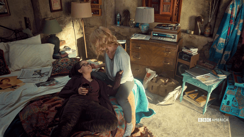 Cosima lays in Delphine's lap and they're cute and they love each other