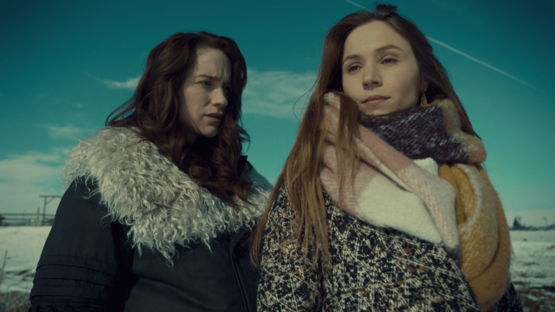 Waverly and Wynonna look pensive and sad