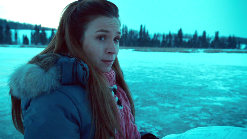 Waverly is standing by the frozen lake, crying