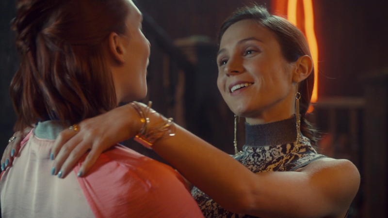 Waverly pulls Nicole toward her with a flirty smile