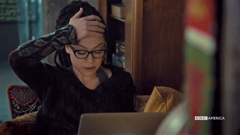 Cosima looks upset at her laptop