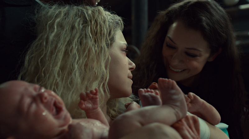 Sarah and Helena smile while holding the bbs