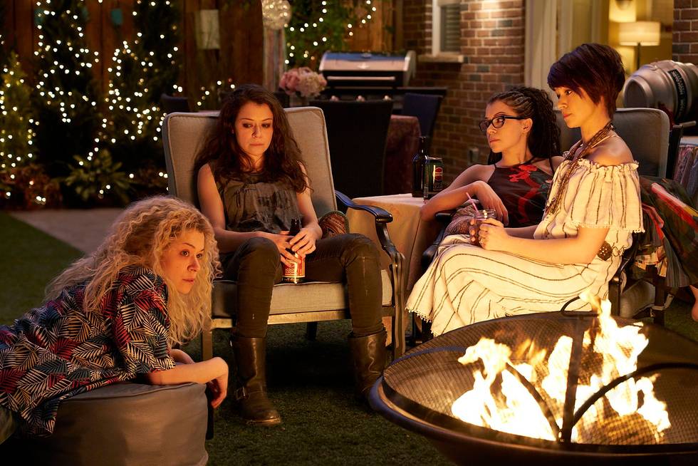 The four sestras bond around the fire.