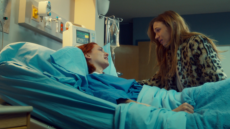 Waverly sits on Nicole's hospital bed