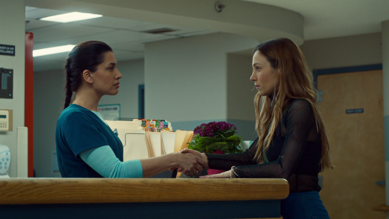 Waverly shakes Greta's hand