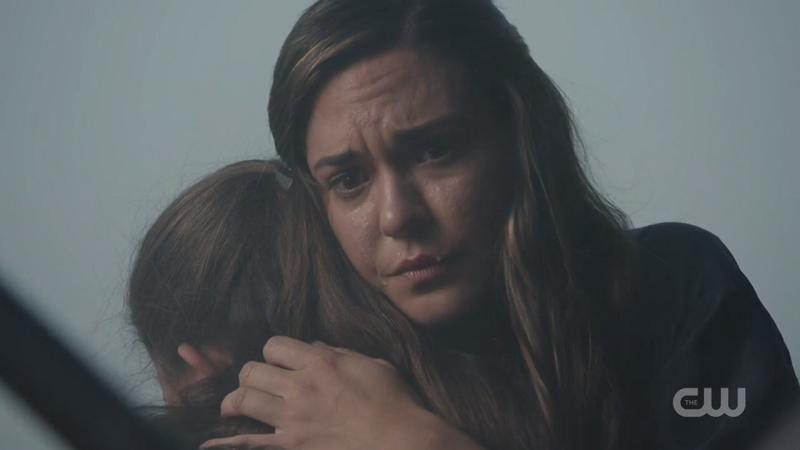 Sam holds her daughter after saving her