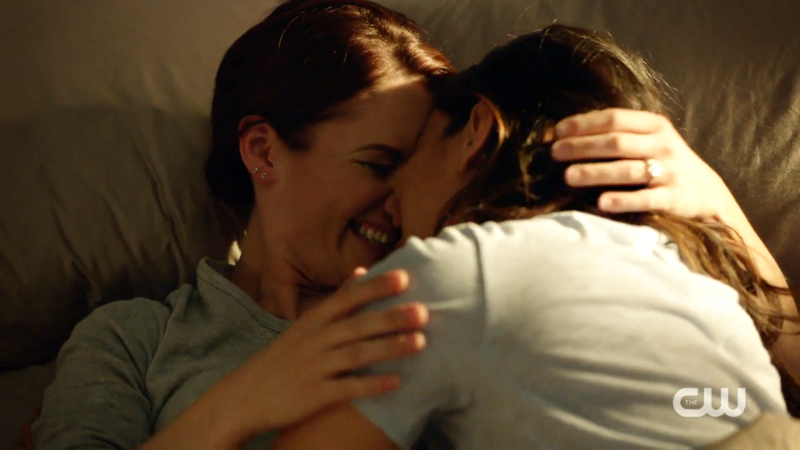 Alex and Maggie are in bed, kissing and giggling