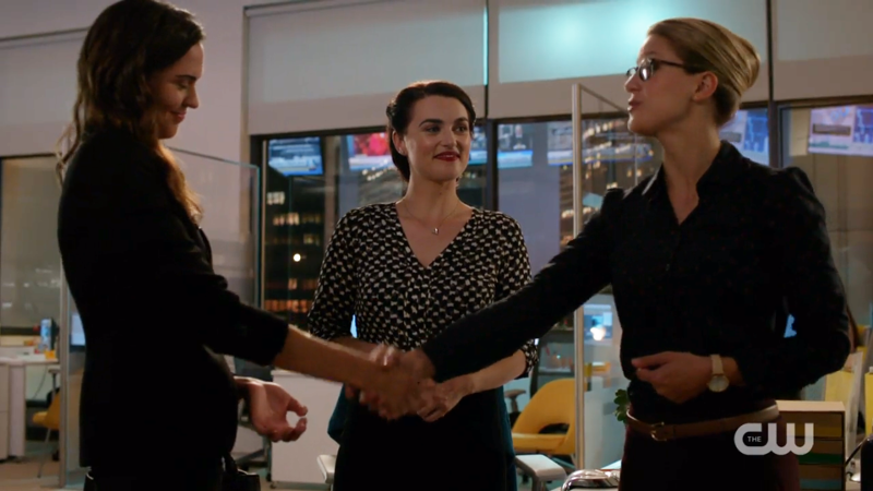 Lena heart-eyes at Kara while Kara shakes Sam's hand